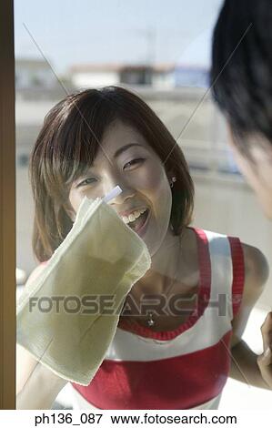 Young couple cleaning windows View Large Photo Image Stock Photo - Young couple cleaning windows. Fotosearch