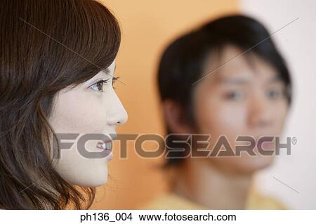 Young couple smiling View Large Photo Image Picture - Young couple smiling. Fotosearch
