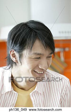 Stock Photo - Young man smiling. Fotosearch