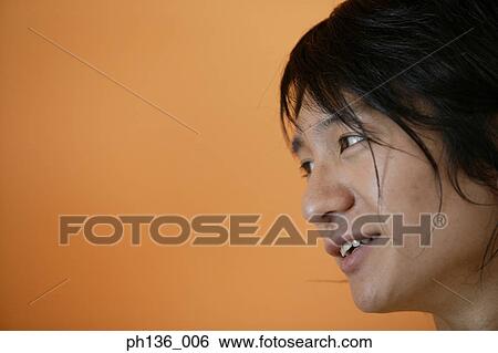 Young man smiling View Large Photo Image Stock Photograph - Young man smiling. Fotosearch