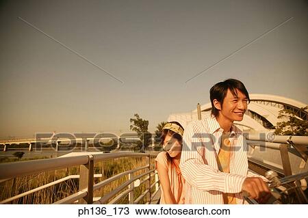 Stock Image - Young couple smiling. Fotosearch