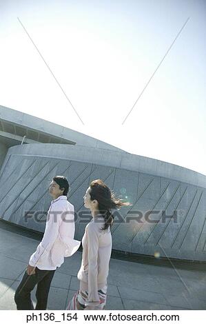Young couple walking View Large Photo Image Picture - Young couple walking. Fotosearch