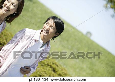 Young couple walking together View Large Photo Image Picture - Young couple walking together. Fotosearch