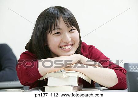 Teenage girl in class View Large Photo Image Stock Image - Teenage girl in class. Fotosearch