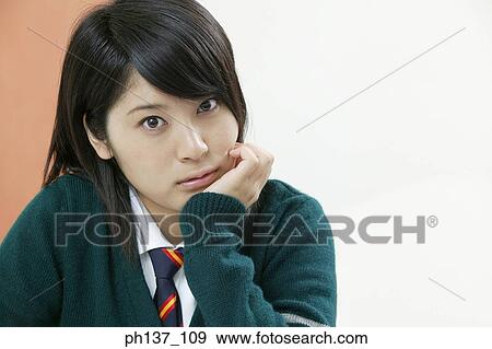 Stock Photo - Teenage girl in class. Fotosearch