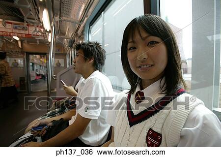 Stock Photograph - Teenage girl sitting in a train. Fotosearch