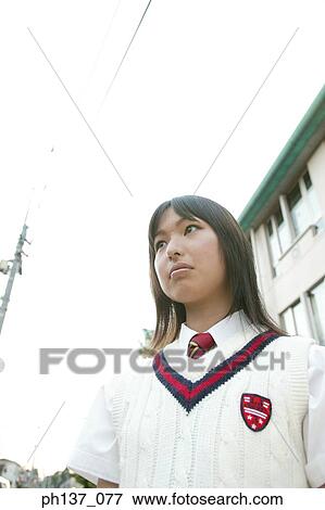 Teenage girl standing outdoors View Large Photo Image Stock Photo - Teenage girl standing outdoors. Fotosearch