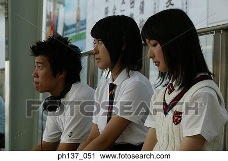 Teenagers sitting together View Large Photo Image Stock Image - Teenagers sitting together. Fotosearch