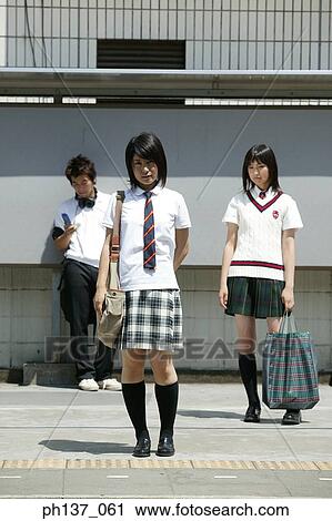Teenagers standing together View Large Photo Image Stock Image - Teenagers standing together. Fotosearch