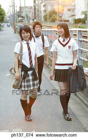 Teenagers walking together View Large Photo Image Picture - Teenagers walking together. Fotosearch