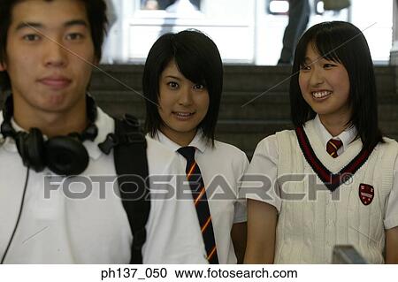 Stock Image - Teenagers walking together. Fotosearch