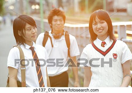 Stock Photograph - Teenagers walking together. Fotosearch
