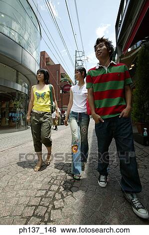 Teenagers walking and talking View Large Photo Image Stock Photo - Teenagers walking and talking. Fotosearch