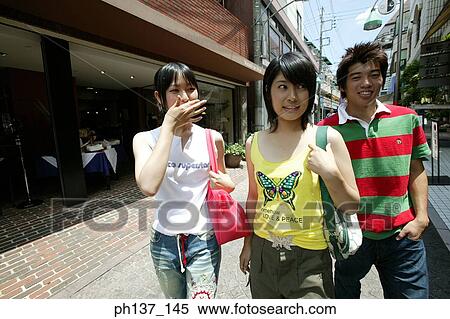 Teenagers walking and talking View Large Photo Image Stock Photography - Teenagers walking and talking. Fotosearch