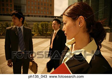 Three executives standing outdoors View Large Photo Image Stock Image - Three executives standing outdoors. Fotosearch