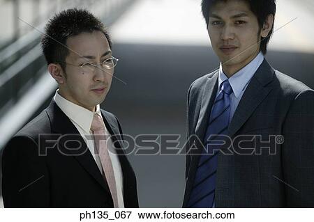 Two young businessmen View Large Photo Image Stock Photo - Two young businessmen. Fotosearch