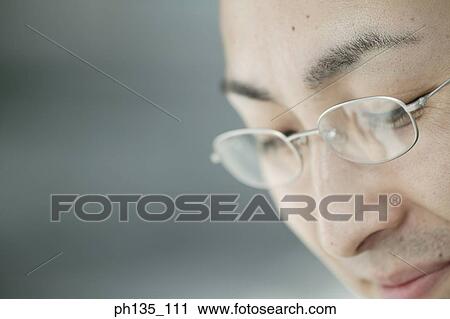 Young businessman wearing eye glasses View Large Photo Image Stock Image - Young businessman wearing eye glasses. Fotosearch