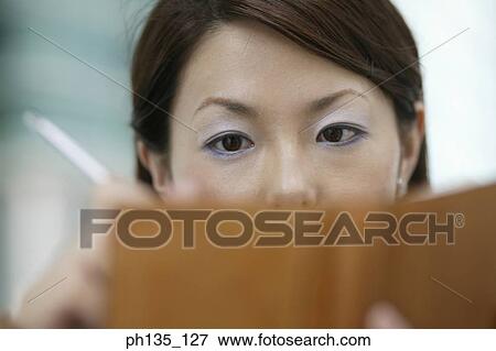 Young businesswoman writing into a diary View Large Photo Image Stock Photo - Young businesswoman writing into a diary. Fotosearch
