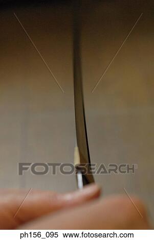 Close-up of a blacksmith's holding a sword View Large Photo Image Stock Photography - Close-up of a blacksmith's holding a sword. Fotosearch