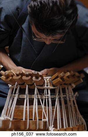 Stock Photo - Close-up of a carpenter making a samisen. Fotosearch