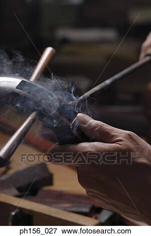 Close-up of a carpenter's hand working with a hot rod View Large Photo Image Stock Photo - Close-up of a carpenter's hand working with a hot rod. Fotosearch
