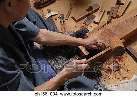 High angle view of a carpenter working with a hammer View Large Photo Image Picture - High angle view of a carpenter working with a hammer. Fotosearch