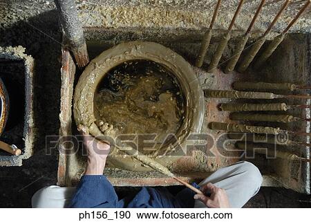 High angle view of a man making candles in a factory View Large Photo Image Stock Image - High angle view of a man making candles in a factory. Fotosearch