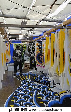 Rear profile of a man arranging painted sheets in a workshop View Large Photo Image Stock Photography - Rear profile of a man arranging painted sheets in a workshop. Fotosearch