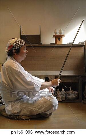 Side profile of a blacksmith holding a sword View Large Photo Image Stock Image - Side profile of a blacksmith holding a sword. Fotosearch