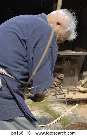 Side profile of a carpenter holding cane View Large Photo Image Stock Image - Side profile of a carpenter holding cane. Fotosearch