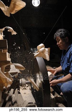Side profile of a mid adult man cutting wood in a workshop View Large Photo Image Stock Photography - Side profile of a mid adult man cutting wood in a workshop. Fotosearch