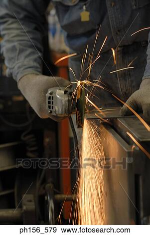 Close-up of a grinder working in a workshop View Large Photo Image Stock Photo - Close-up of a grinder working in a workshop. Fotosearch