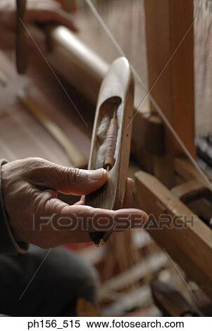 Close-up of a person's hand operating a loom View Large Photo Image Stock Photography - Close-up of a person's hand operating a loom. Fotosearch