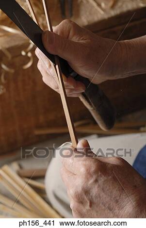 Close-up of a person's hands dividing a wooden stick View Large Photo Image Stock Image - Close-up of a person's hands dividing a wooden stick. Fotosearch