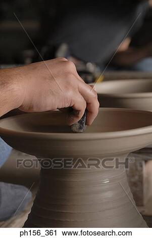 Close-up of a person's hands making pottery View Large Photo Image Stock Image - Close-up of a person's hands making pottery. Fotosearch