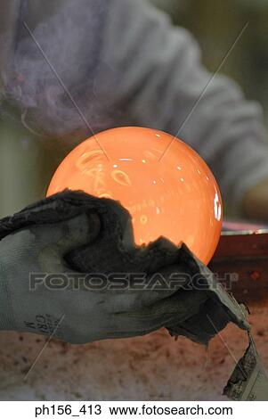 Close-up of a person's hands molding a glass bulb View Large Photo Image Stock Image - Close-up of a person's hands molding a glass bulb. Fotosearch