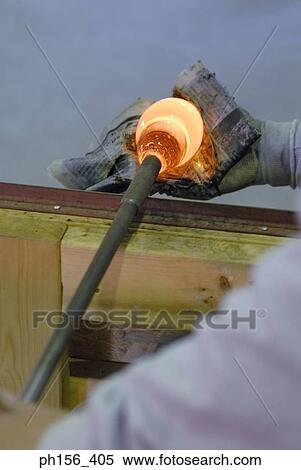 Close-up of a person's hands molding a glass bulb View Large Photo Image Stock Photography - Close-up of a person's hands molding a glass bulb. Fotosearch