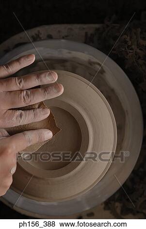 Close-up of a potter's hands making a vase on a pottery wheel View Large Photo Image Stock Photo - Close-up of a potter's hands making a vase on a pottery wheel. Fotosearch