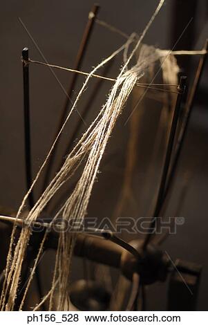 Close-up of a spinning wheel View Large Photo Image Stock Photo - Close-up of a spinning wheel. Fotosearch