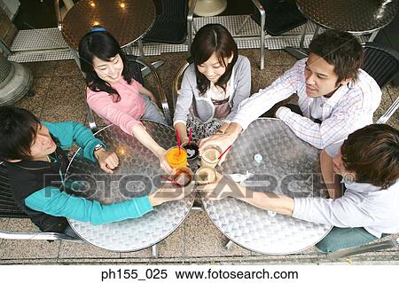 High angle view of five friends toasting glasses View Large Photo Image Stock Photography - High angle view of five friends toasting glasses. Fotosearch