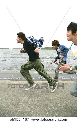 Side profile of three young men running together near a river View Large Photo Image Stock Photo - Side profile of three young men running together near a river. Fotosearch