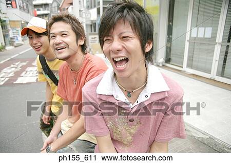 Three young men smiling View Large Photo Image Stock Image - Three young men smiling. Fotosearch