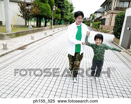 Father holding hands and working with his son View Large Photo Image Stock Photography - Father holding hands and working with his son. Fotosearch