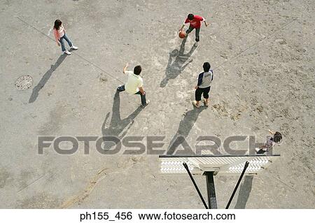High angle view of five people playing basketball View Large Photo Image Stock Photograph - High angle view of five people playing basketball. Fotosearch