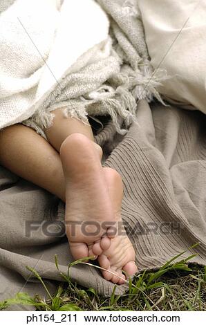 Stock Image - Close-up of a child's bare feet. Fotosearch