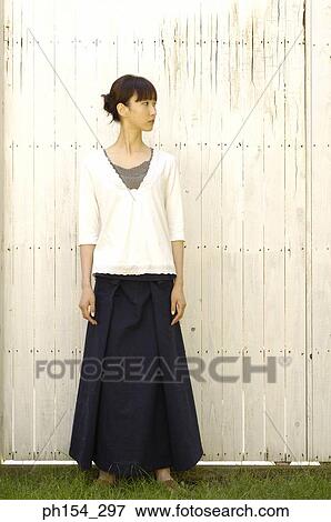 Stock Photo - Close-up of a young woman standing. Fotosearch