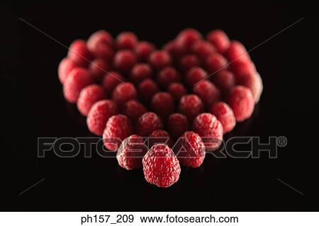 Raspberries in a heart shape View Large Photo Image Stock Photo - Raspberries in a heart shape. Fotosearch