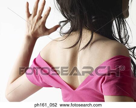 Back view of a woman in pink T shirt View Large Photo Image Stock Image - Back view of a woman in pink T shirt. Fotosearch