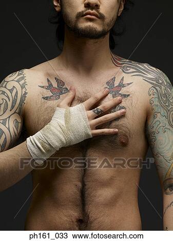 Bare chested young man with bandaged hand on chest View Large Photo Image Stock Image - Bare chested young man with bandaged hand on chest. Fotosearch