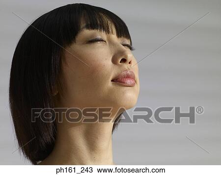 Close-up of woman's face, eyes closed View Large Photo Image Stock Image - Close-up of woman's face, eyes closed. Fotosearch